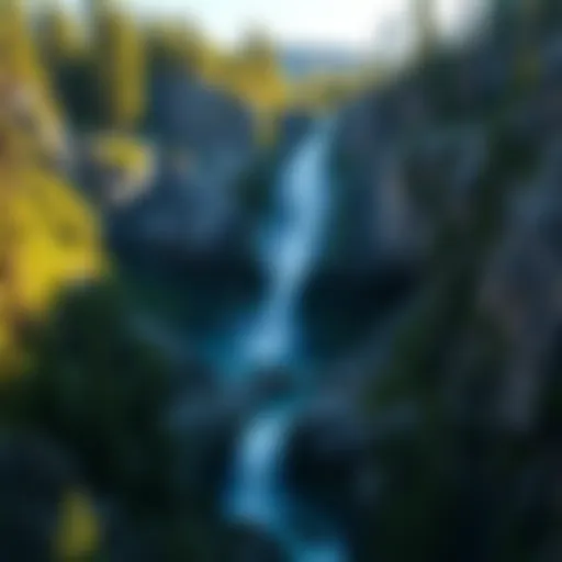 Majestic waterfall cascading down rocky cliffs surrounded by lush greenery