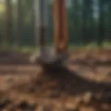 Close-up of a screw pile installed in soil