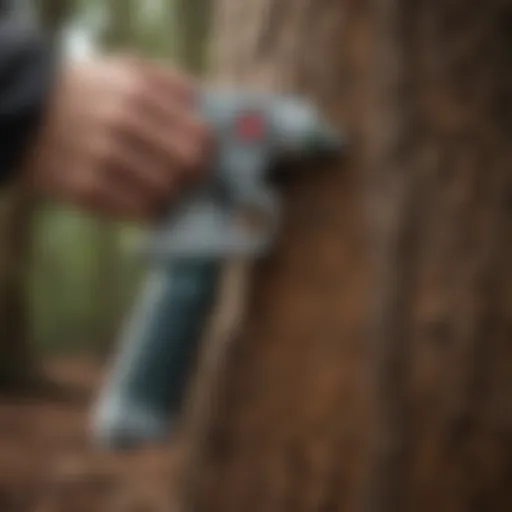 Close-up of a tree marking paint gun in action